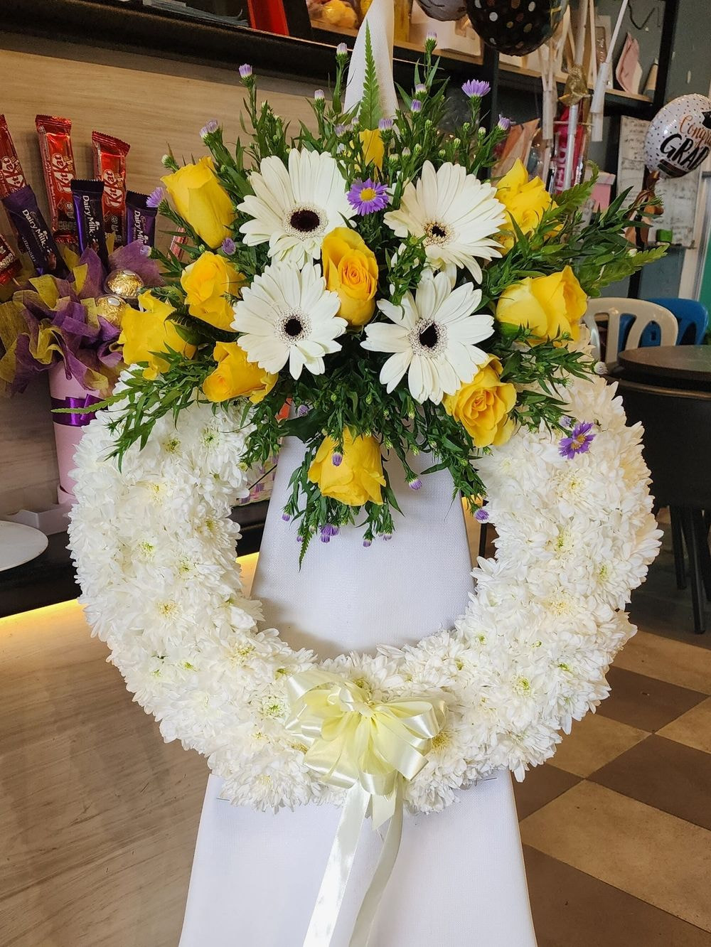 Express your sympathy and condolences with our Small Wreath with Wood Stand