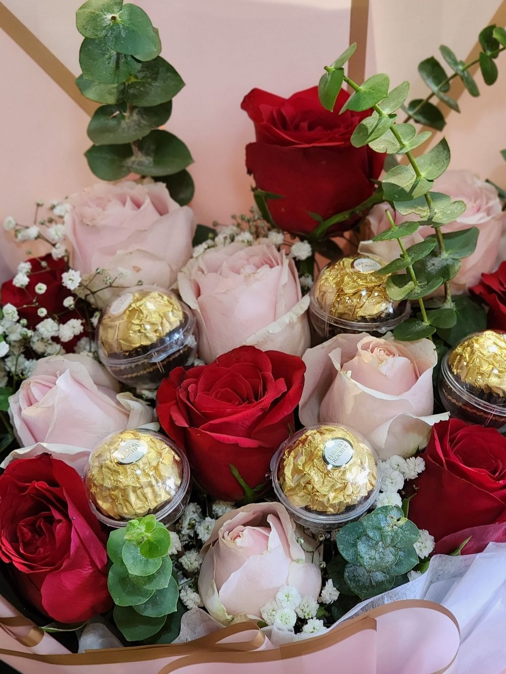 Medium size: 12rose mix color flower arrangements with 6 Ferrero Rocher, Baby Breath & Eucalyptus.