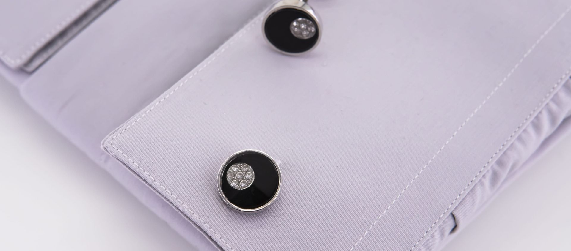 Round black cufflinks with glitter
