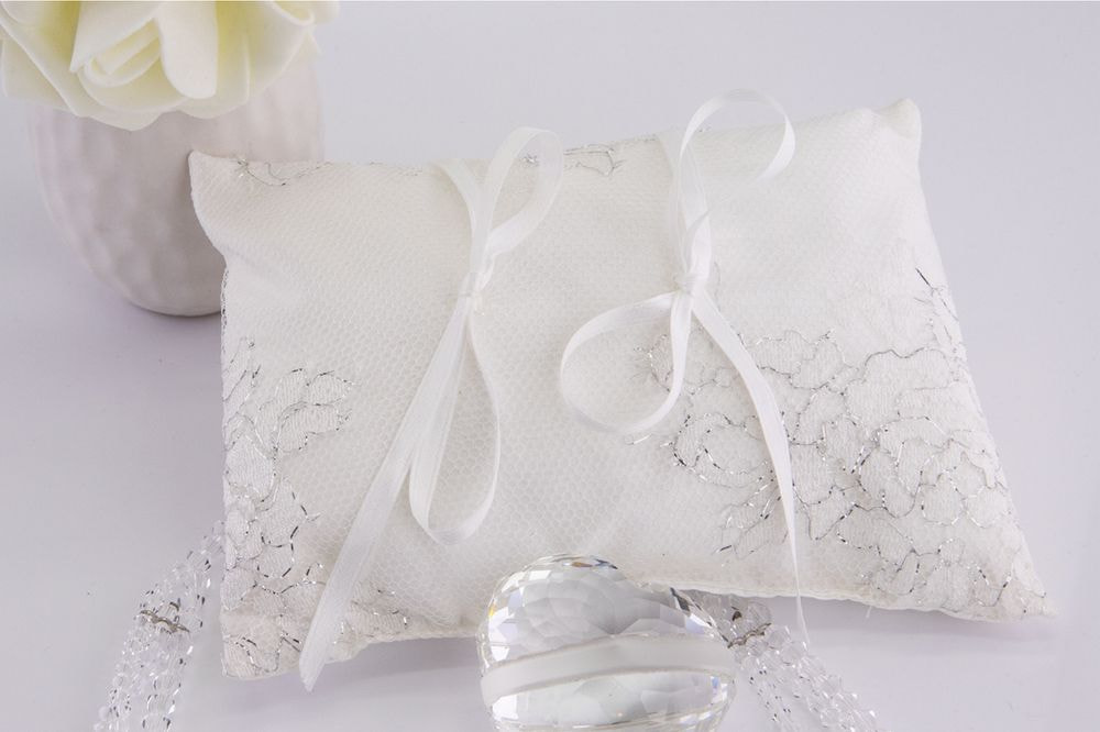 White satin ring bearer pillow with silver threads