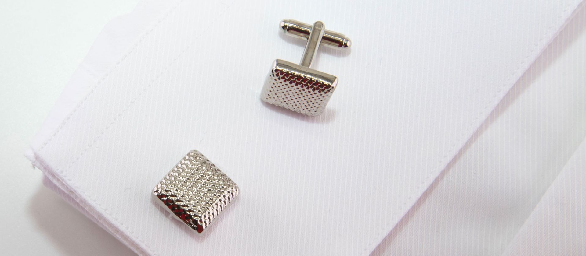 Square silver-colored cufflinks